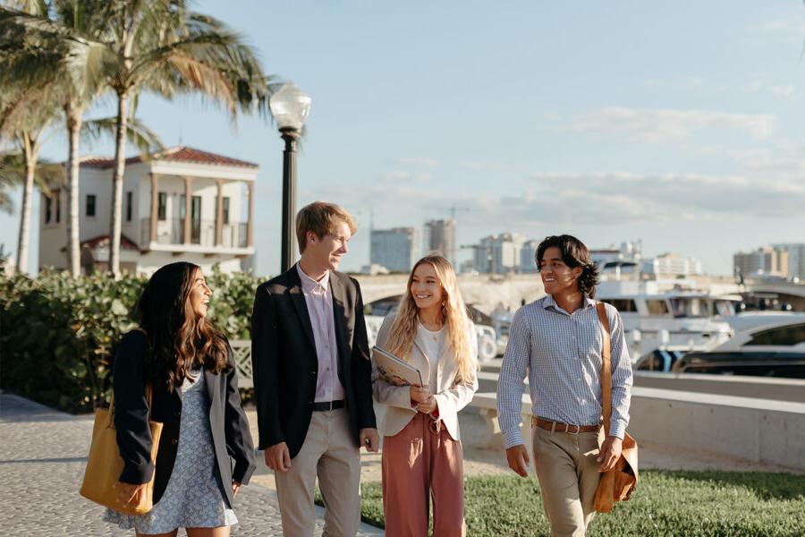 master of business administration mba students walk near the intercoastal waterway in 西<a href='http://9kwp.dreamgatellc.com/'>推荐全球最大网赌正规平台欢迎您</a>.